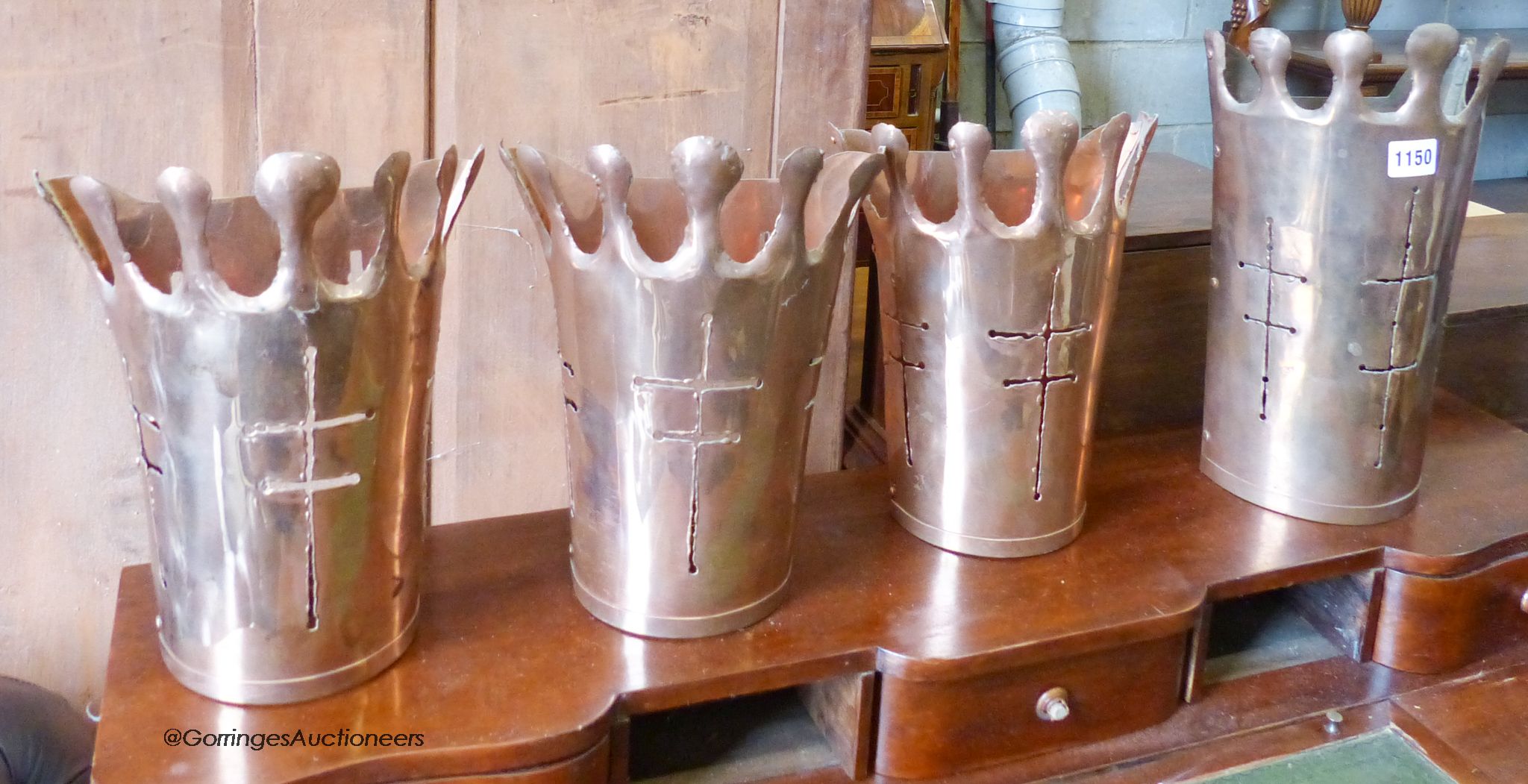 A set of four pierced copper wall sconces. Largest, H-33cm.